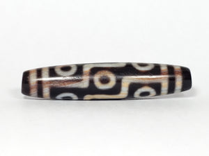 real antique Tibetan nine eye dzi bead with extreme bloodspots.  highly collectable dzi bead.