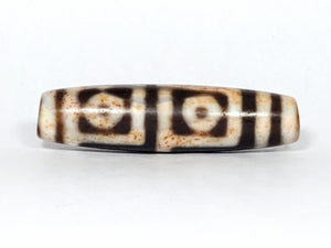 real four eye motif Tibetan dzi bead with extreme bloodspots.  the bloodspots, a.k.a. cinnabar dots, are visible to the naked eye.  very rare item.  a collector's dream piece. - visit the Ancient Dzi Shop for more dzi selections