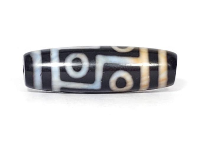 A vintage Dzi bead featuring a captivating Six Eye Motif. This authentic artifact, identified as TaD-V-S-SiE-051423, showcases the intricate patterns and spiritual significance of ancient Dzi beads