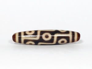 genuine Tibetan dzi bead with nine eye pattern.  extremely beautiful and extremely powerful.