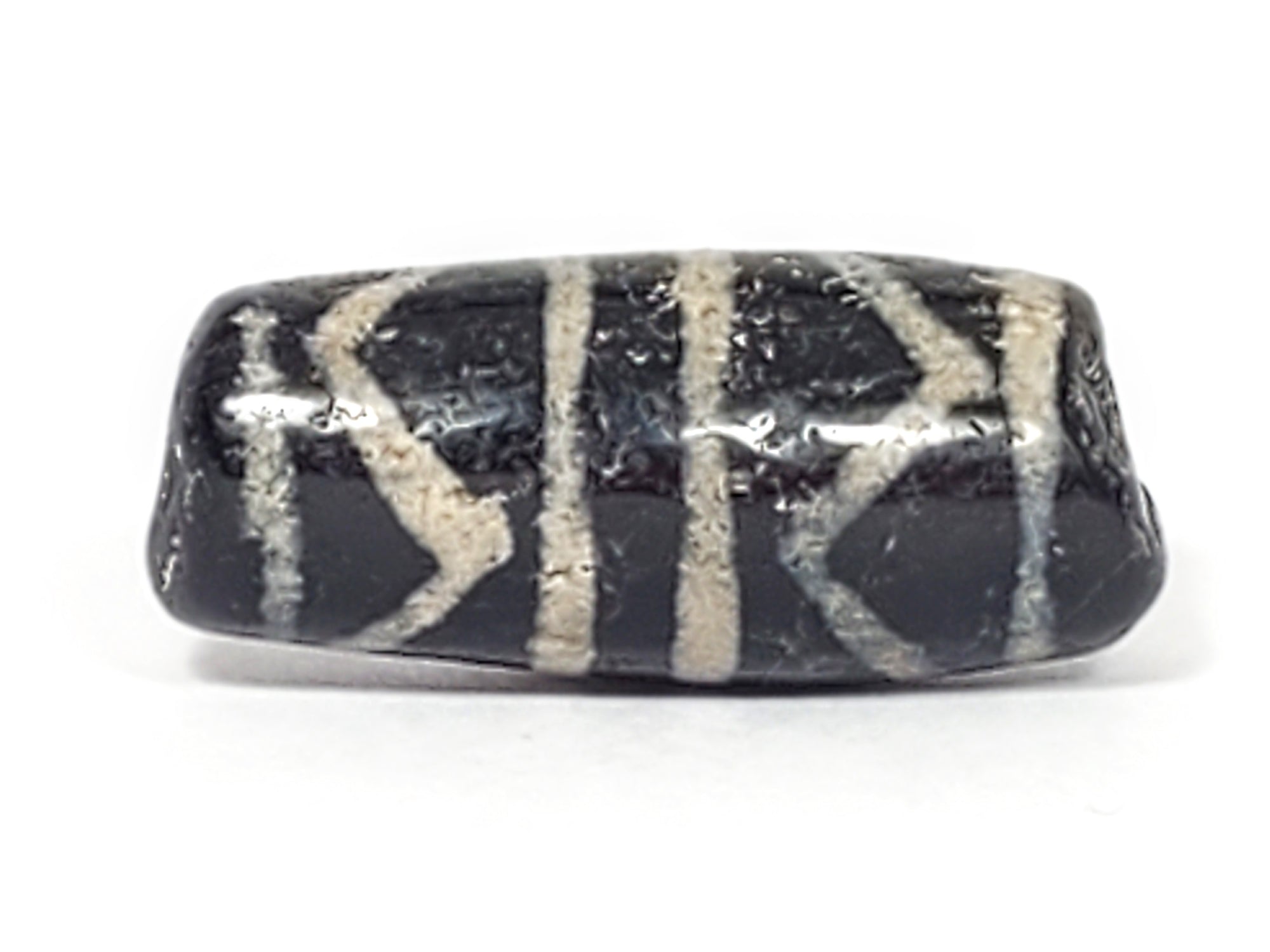 Ancient Dzi Bead - Double Tiger Tooth Motif - Calcification Detail. A remarkable ancient Dzi bead featuring an exquisite double tiger tooth motif and captivating calcification formations."