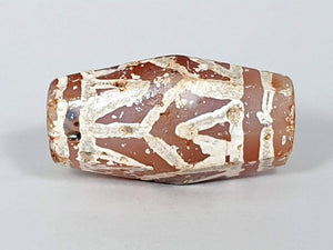  Ancient Lotus & Tiger Tooth Motif Dzi (T1D-LTT-005) - Octagon Shape. An authentic ancient Dzi bead adorned with the enchanting Lotus and Tiger Tooth motif, known for its exceptional condition and rarity. This octagon-shaped bead represents the harmonious blend of grace and strength, symbolizing spiritual purity and protection. With its intricate patterns and weathered appearance, this Dzi bead is a treasured artifact that reflects the rich cultural heritage of Tibetan traditions