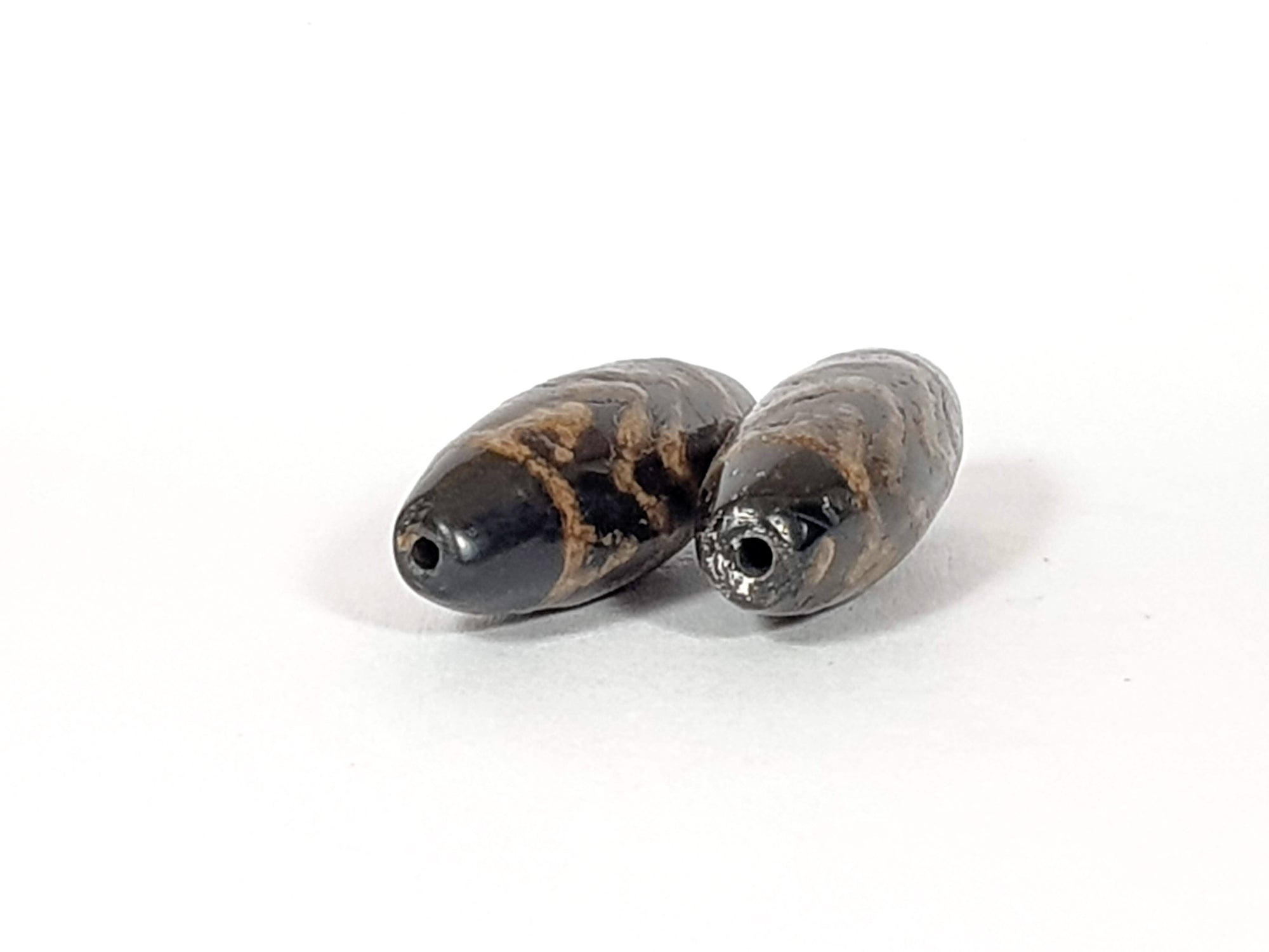 Pair of Antique Four Tiger Tooth Motif Dzi Beads