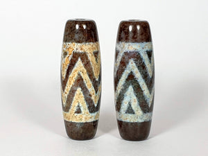 pair of xiangxiong style dzi beads adorned with three rows of tiger stripes - extreme bloodspot inclusions on these beads