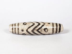 Vintage White Tiger Stripes, Eyes & Stars Dzi Bead" Description: "A vintage Dzi bead with a faux antique appearance featuring captivating white tiger stripes, mesmerizing eyes, and celestial stars motif