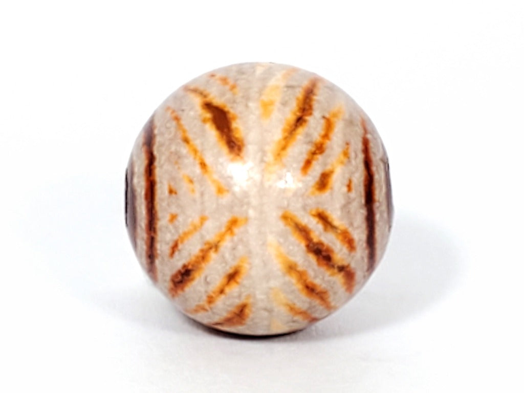 Ancient Round Double Diamond Eye-In-Eye Motif Carnelian Dzi Bead. An ancient round Dzi bead featuring a distinctive Double Diamond Eye-In-Eye motif. This Carnelian Dzi bead holds immense historical and cultural value, reflecting the meticulous craftsmanship of Tibetan artisans