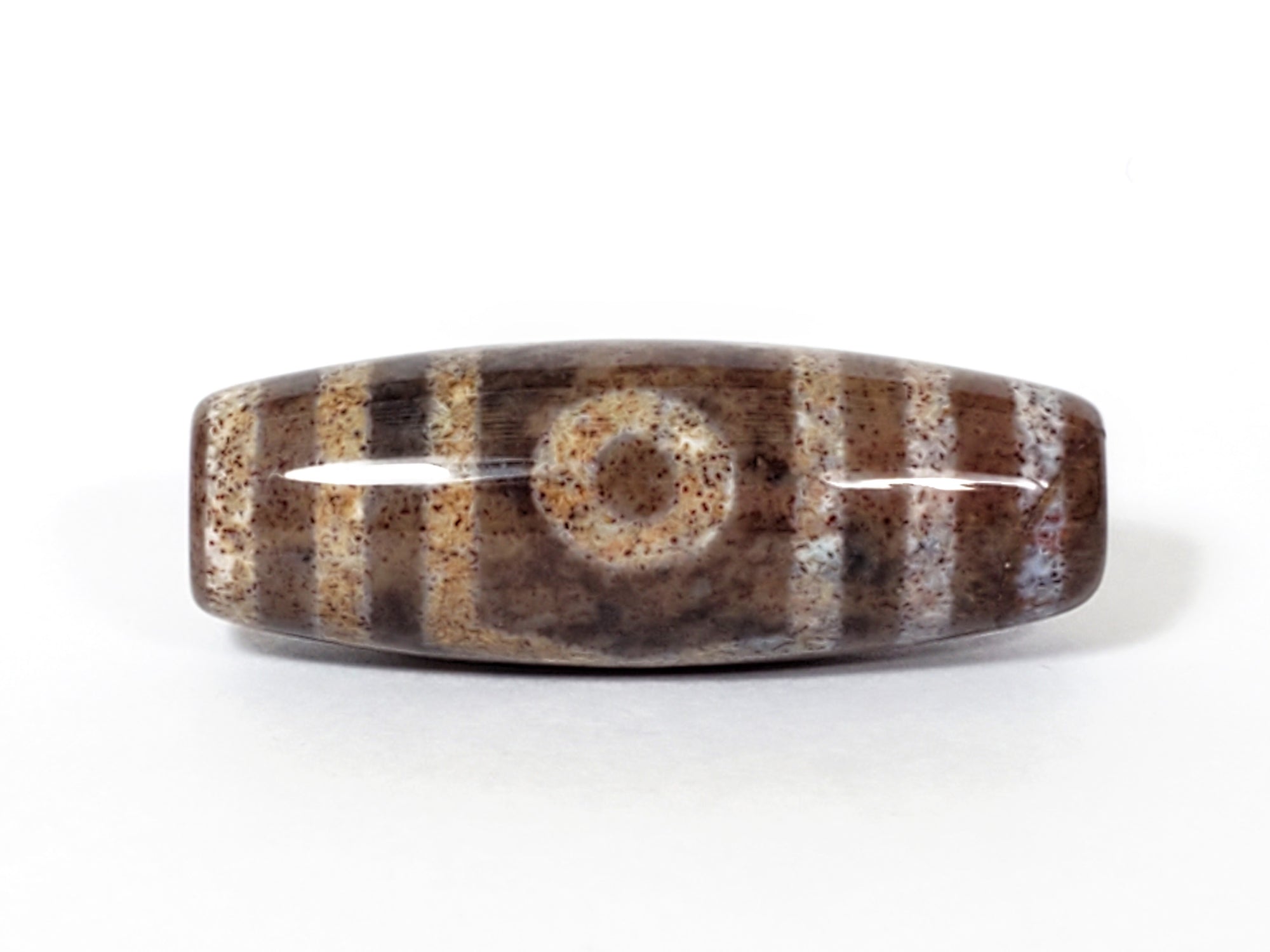 three eye dzi bead with extreme bloodspot inclusions