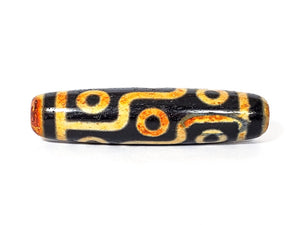 A vintage Dzi bead with a faux antique appearance featuring a captivating nine-eye motif. The bead exhibits intricate carvings and an aged texture, reminiscent of ancient artifacts with deep spiritual significance. The nine eyes symbolize protection, wisdom, and spiritual insight