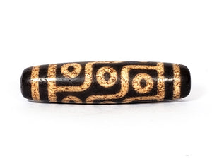 A vintage Dzi bead with a faux antique appearance featuring a mesmerizing nine-eye motif. The intricate carvings and weathered texture give it an ancient look, evoking a sense of spiritual power and wisdom. The nine eyes symbolize protection, insight, and spiritual enlightenment. 