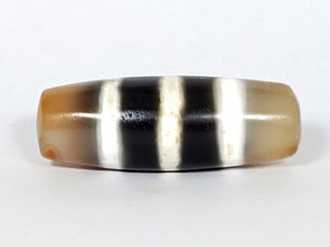 Authentic vintage Five Stripe Chung Dzi bead showcasing its unique five stripe pattern. This ancient bead holds historical and cultural significance