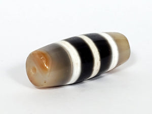 Authentic vintage Five Stripe Chung Dzi bead showcasing its unique five stripe pattern. This ancient bead holds historical and cultural significance