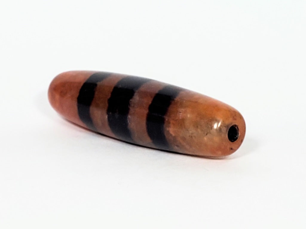 Five Stripe Chung Dzi - 措思天珠" Description: "Authentic Five Stripe Chung Dzi bead known as 措思天珠. This ancient bead showcases its unique five stripe pattern and carries cultural significance