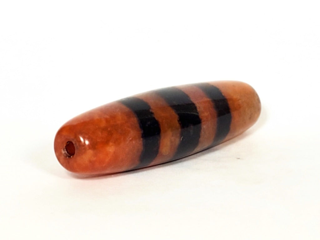 Five Stripe Chung Dzi - 措思天珠" Description: "Authentic Five Stripe Chung Dzi bead known as 措思天珠. This ancient bead showcases its unique five stripe pattern and carries cultural significance