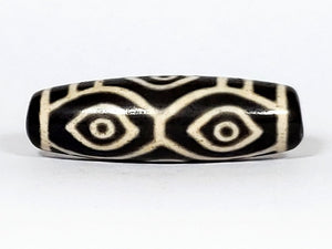 Vintage Dragon Eye Dzi Bead" Description: "A mesmerizing vintage Dzi bead featuring a captivating dragon eye motif. The intricate details and vibrant colors of the bead create an aura of mystique and power