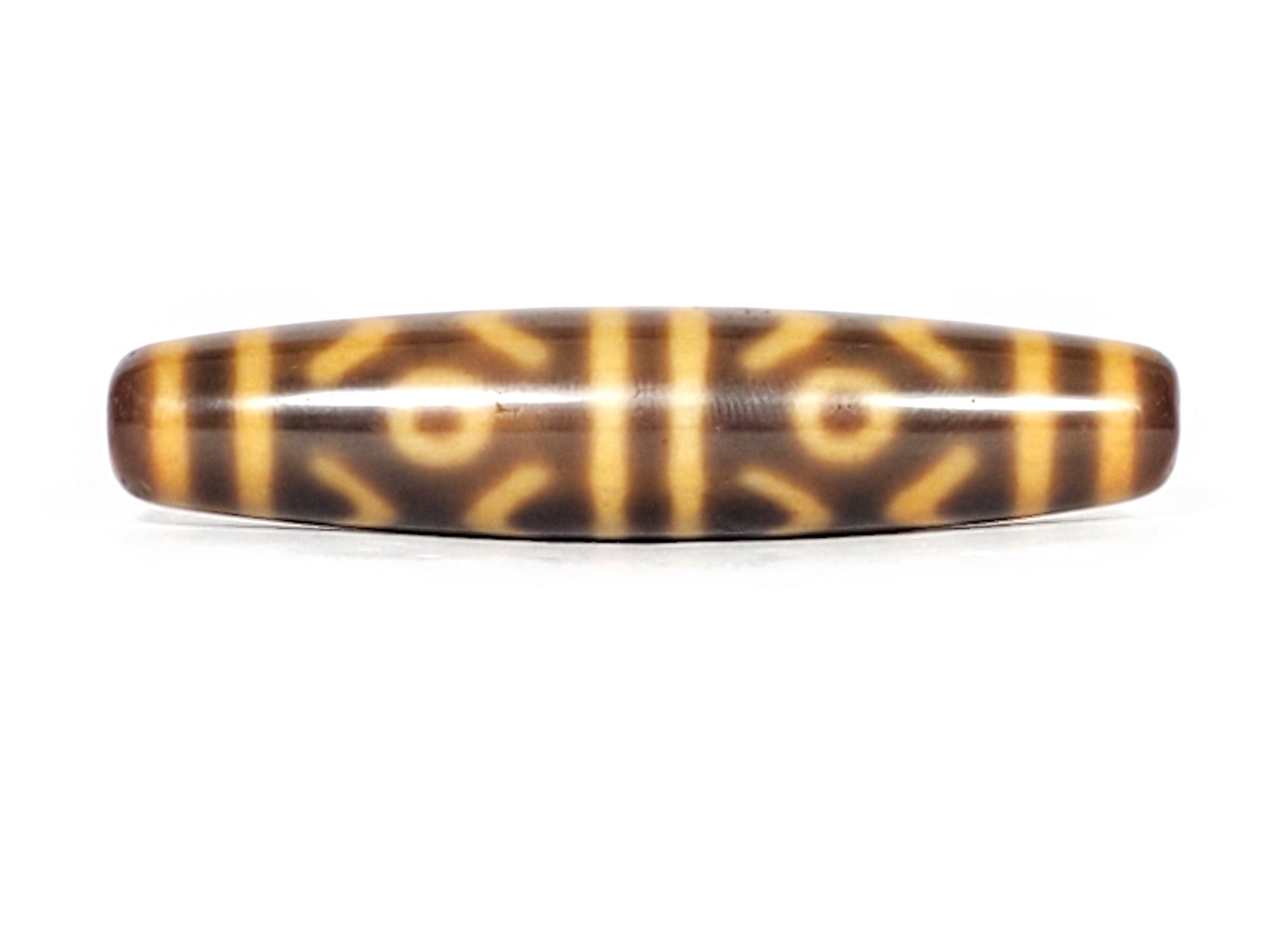 real Tibetan dzi featuring six eye & tiger tooth motif.  Very rare.