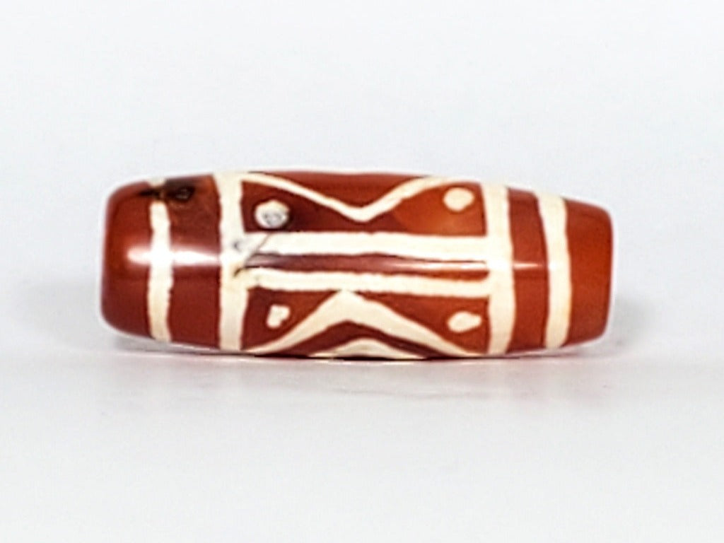 Collectible Diamond Eye-In-Eye & Star Motif Carnelian Dzi Bead" Description: "Collectible Dzi bead carved from carnelian, adorned with an enchanting Diamond Eye-In-Eye & Star motif. This bead holds immense collectible value and artistic charm."