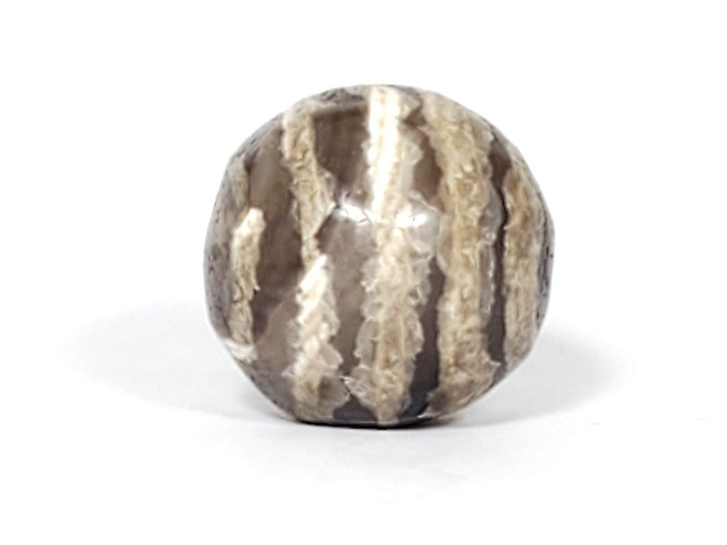 Ancient Dzi Bead - Five Stripe Motif. An authentic ancient Dzi bead featuring an intricate Five Stripe motif, representing a connection to ancient traditions and cultural heritage. This bead holds spiritual significance and is admired for its craftsmanship and historical value."