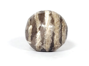 Ancient Dzi Bead - Five Stripe Motif. An authentic ancient Dzi bead featuring an intricate Five Stripe motif, representing a connection to ancient traditions and cultural heritage. This bead holds spiritual significance and is admired for its craftsmanship and historical value."