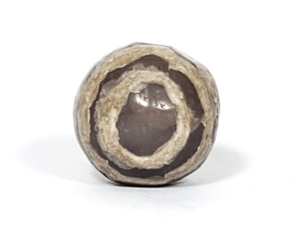 Ancient Dzi Bead - Five Stripe Motif. An authentic ancient Dzi bead featuring an intricate Five Stripe motif, representing a connection to ancient traditions and cultural heritage. This bead holds spiritual significance and is admired for its craftsmanship and historical value."