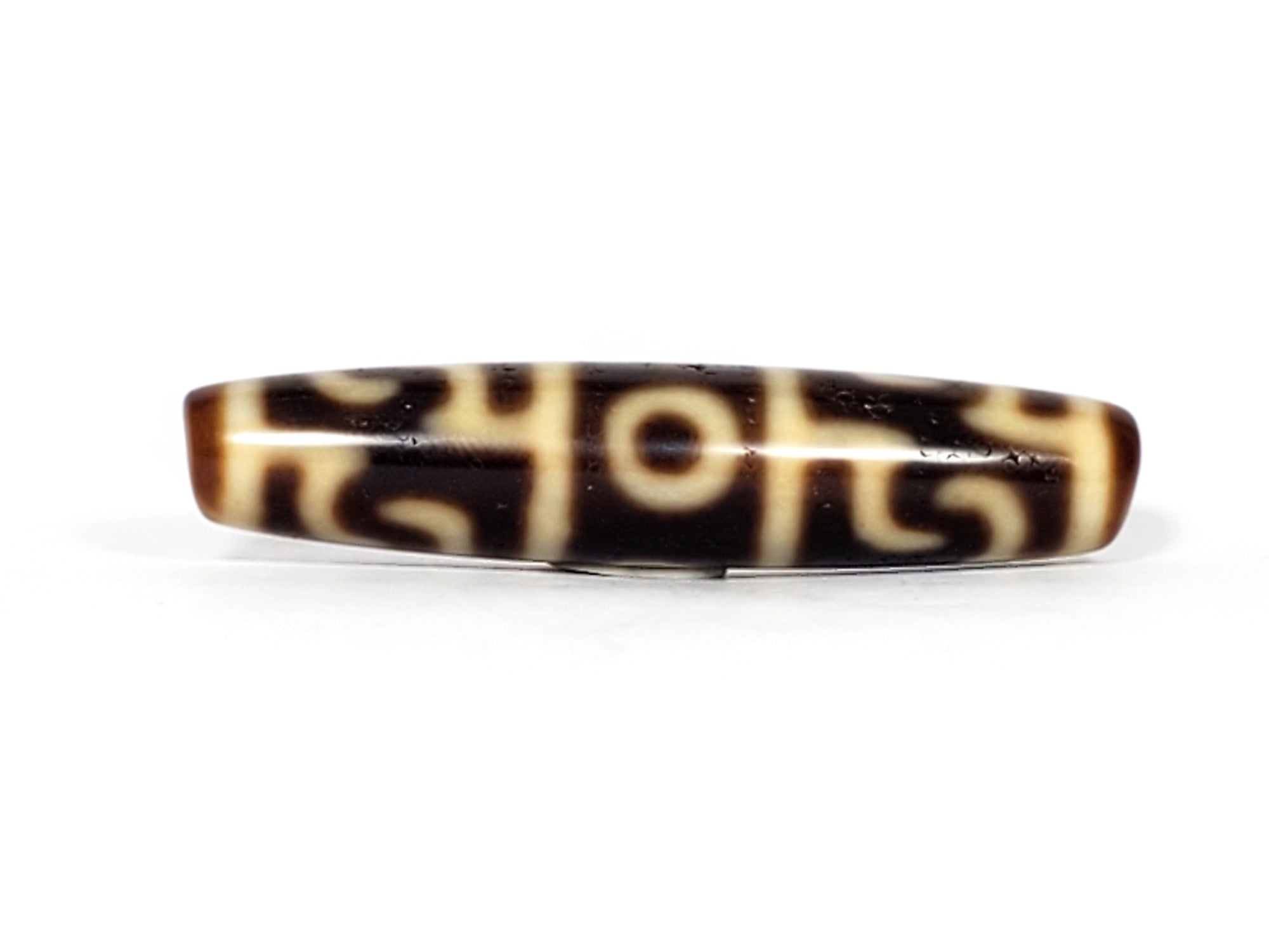 real Tibetan dzi bead featuring the Guru Rinpoche's Ritual Paraphernalia