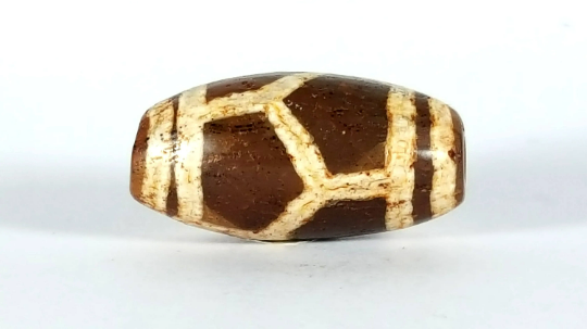 small ancient longevity dzi beadreal antique dzi bead with tortoise shell motif.  this bead features bloodspots.